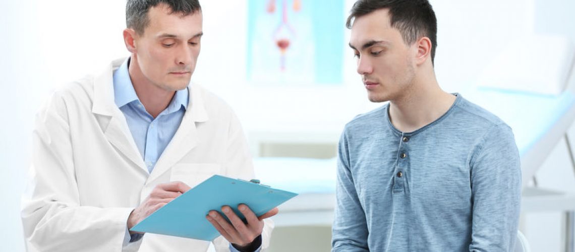 Man with urology problem visiting doctor at hospital